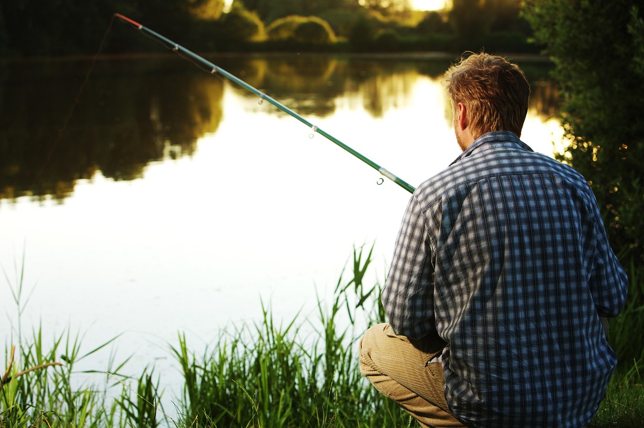 Angler fishing for barramundi in Australian estuary