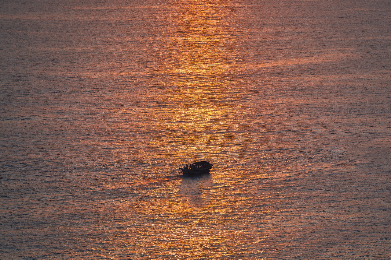 Sunset fishing boat offshore for tuna
